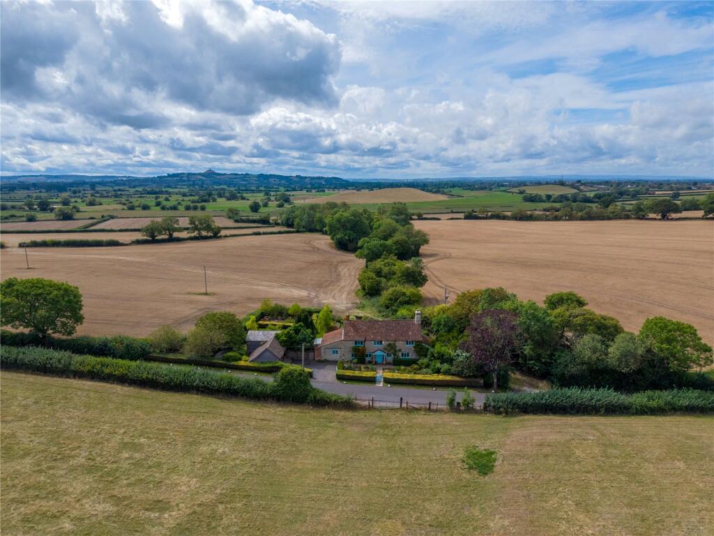 Main image of property: A Charming Detached Country Home with Glastonbury Tor Views, Beautiful Gardens and Self-Contained Annexe
