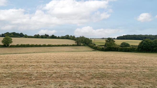 Land for sale with extensive road frontage.