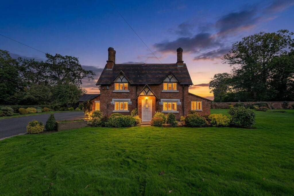 Main image of property: Cheshire cottage with, barns, garaging, stables and over 7 acres of land