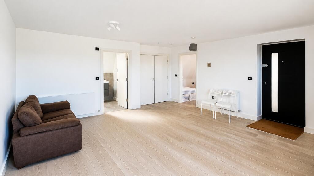 Main image of property: Flat 7, Bakers Yard, 49a High Street, Cobham, KT11 3DL