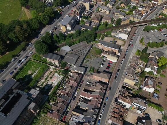 Aerial view showing road frontage, access points and the railway line beyond