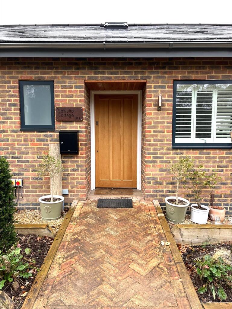 Main image of property: Cowslip Cottage, Woodlands Road, Little Bookham, Surrey