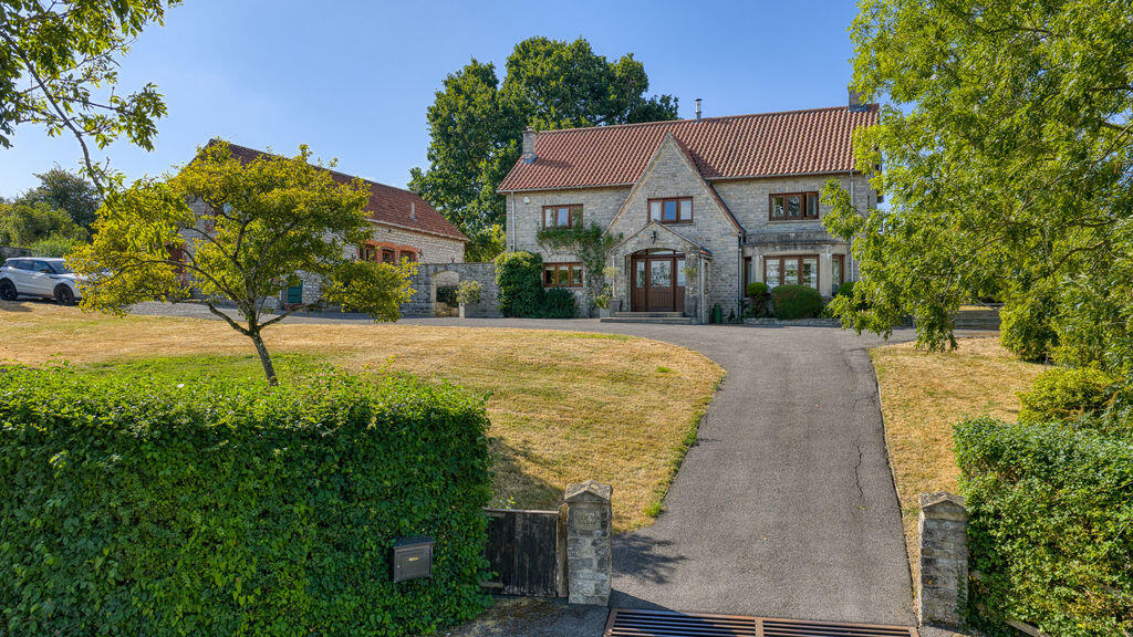 Main image of property: Family home, large garden, annexe and stunning views